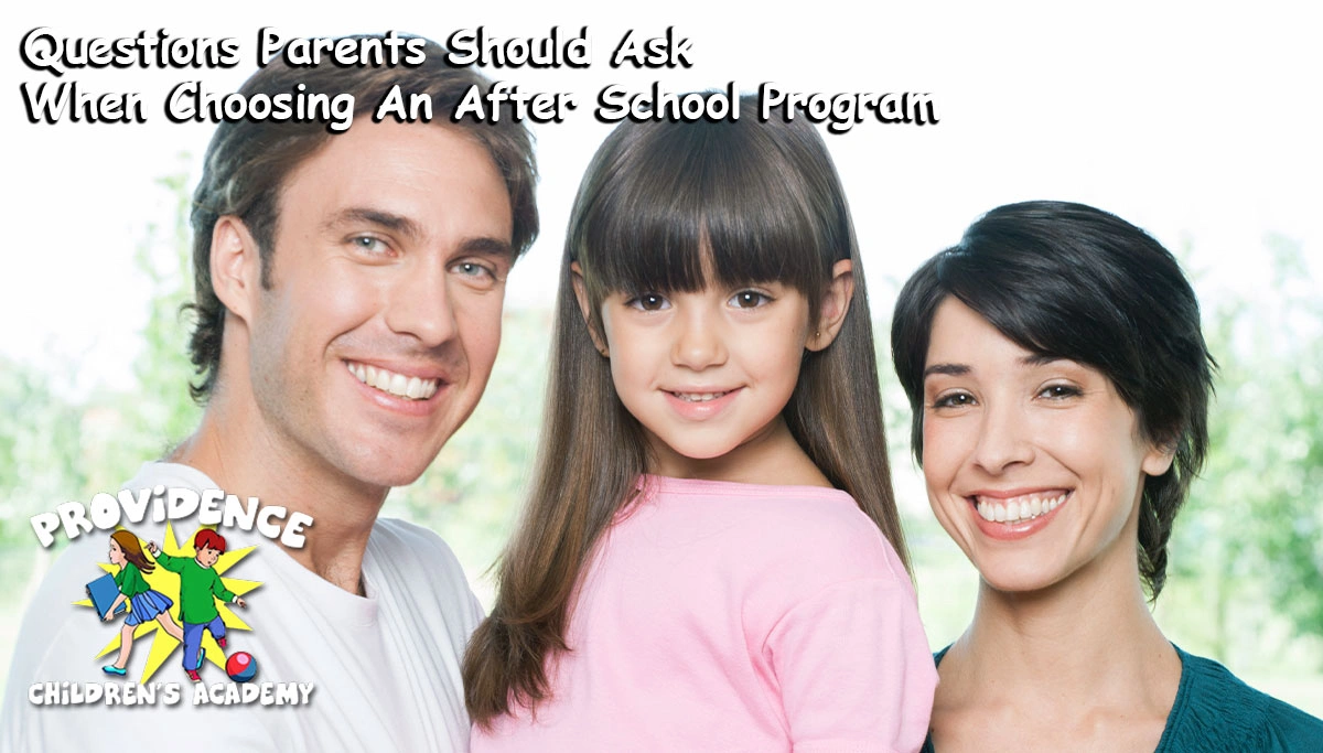 Father, daughter and mother smiling